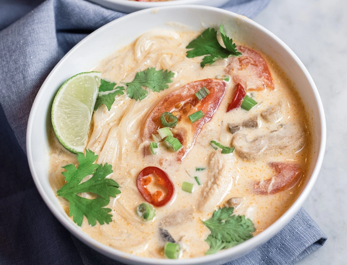 Tom kha pasta with chicken and mushrooms in coconut cream sauce