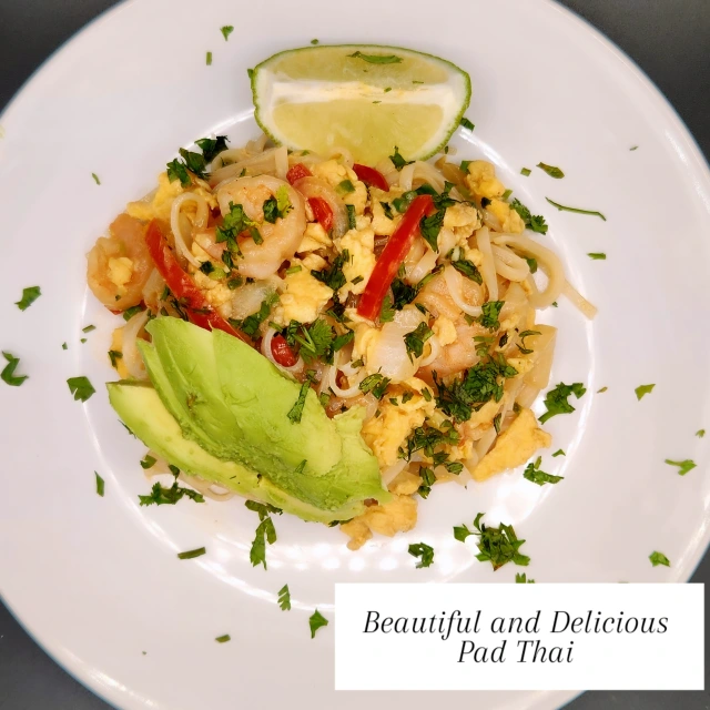 Shrimp pad thai with avocado, red chili, cilantro, and lime