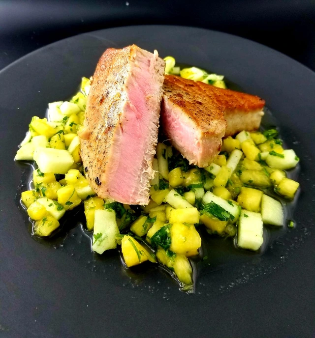 Seared rare tuna steak over fresh pineapple and cucumber salsa