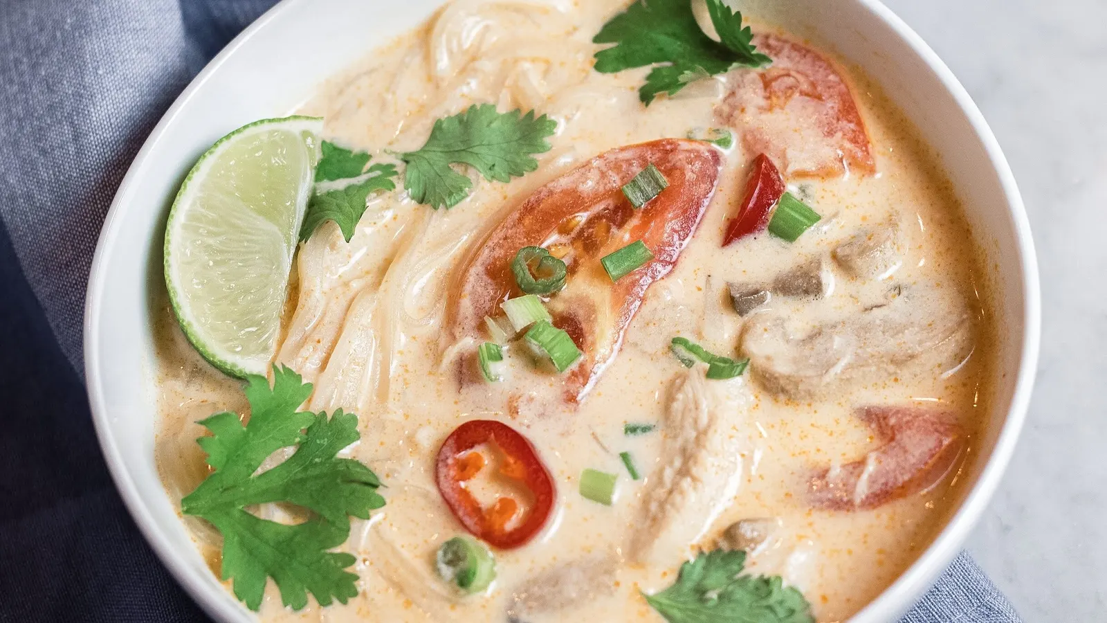 Tom kha pasta with chicken and mushrooms in coconut cream sauce