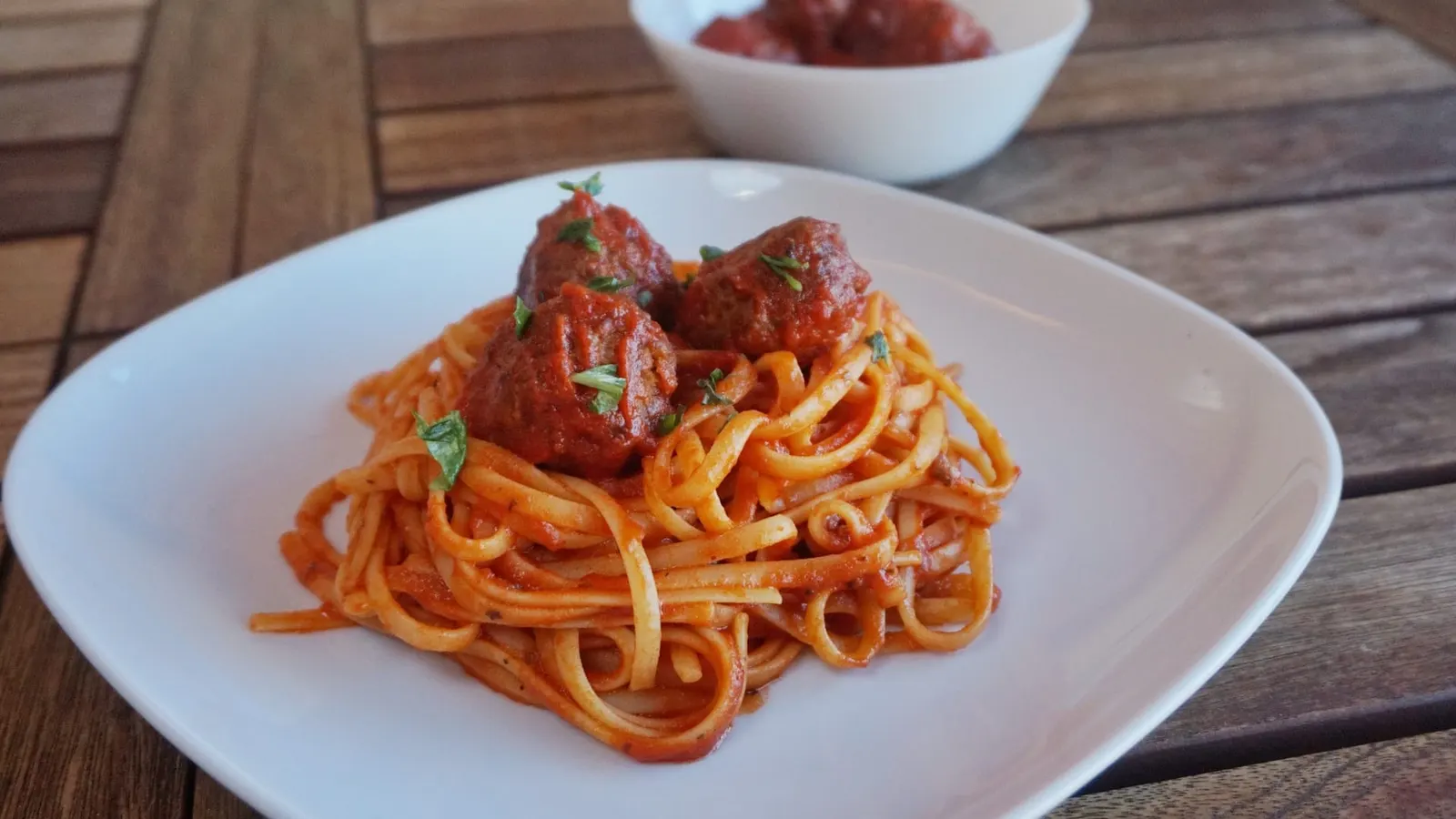 Basil meatballs over spaghetti pomodoro by Eklectic Kitchen